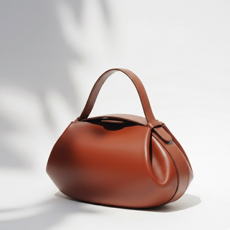 Minimalist Sculptural Handbag with Curved Flap