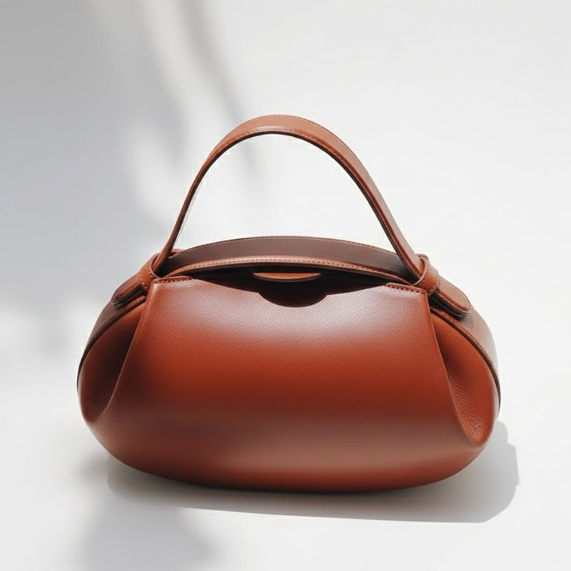 Minimalist Sculptural Handbag with Curved Flap