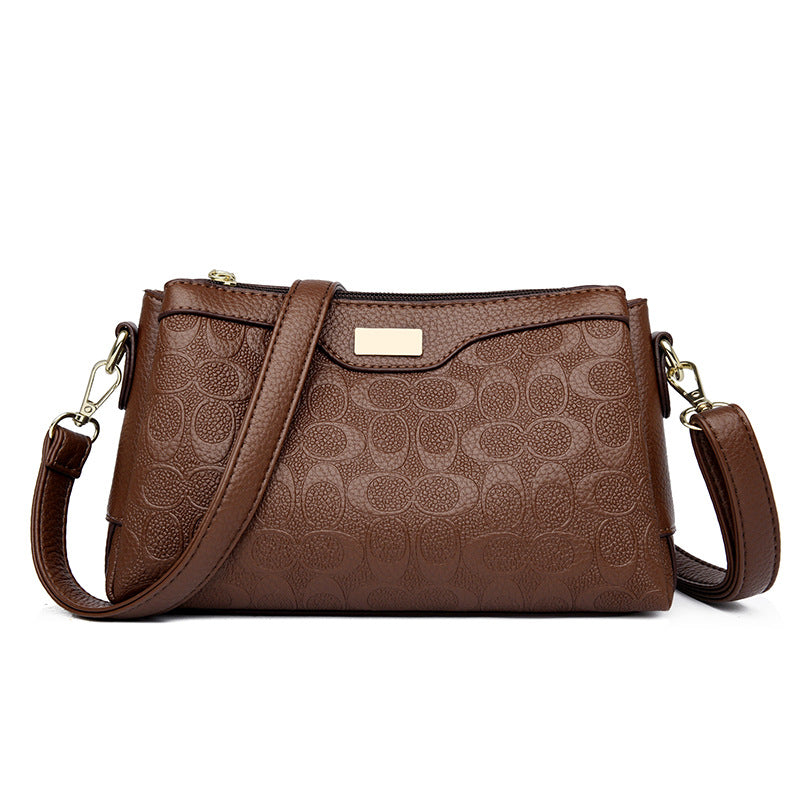 Noir Embossed Accordion Crossbody Bag