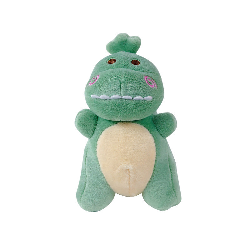 Green dinosaur plush bag charm with cute embroidered features
